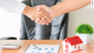 Loan agent and client shaking hands after signed contract for a FHA Loan in Florida.